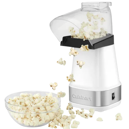 A popcorn maker is shown popping fresh popcorn into a bowl, with some popcorn spilling over the sides.