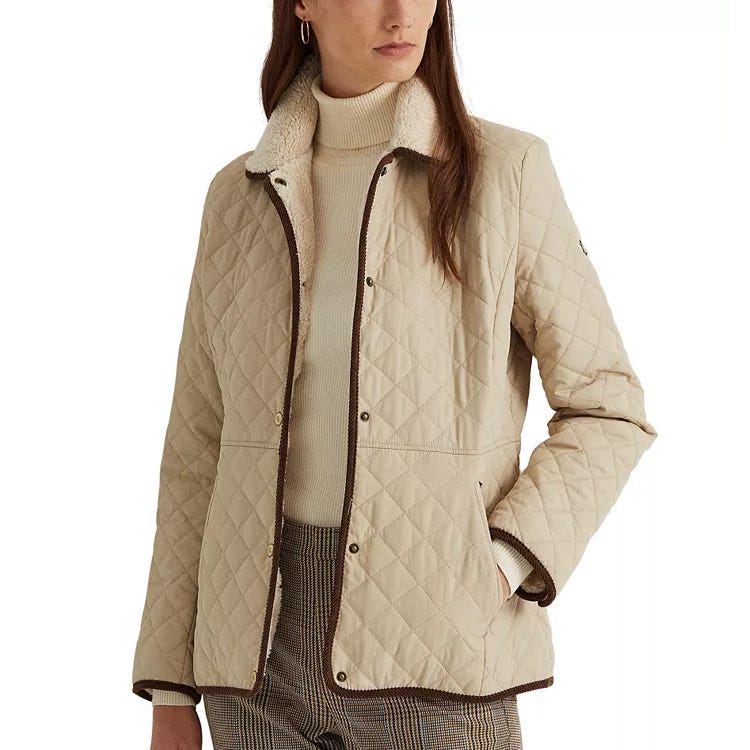 A quilted coat with a faux-sherpa collar, featuring a zip and snap-button front closure, and tailored with a straight fit. The coat is beige with contrasting brown trim.