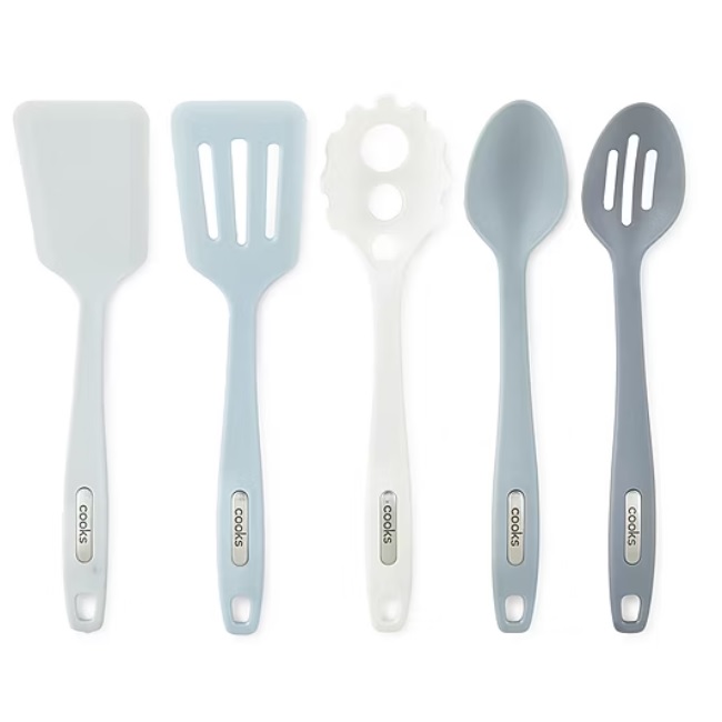 A 5-piece kitchen tool set in shades of gray and white includes a solid spatula, slotted spatula, pasta server, solid spoon, and slotted spoon, each with a hole in the handle for hanging.