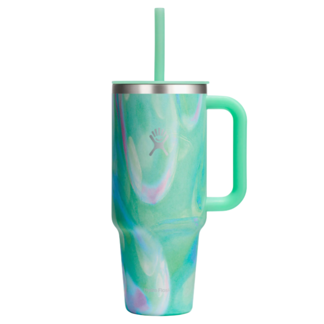 A mint green Hydro Flask tumbler with a swirling pattern, featuring a handle and a straw, designed for keeping drinks insulated.