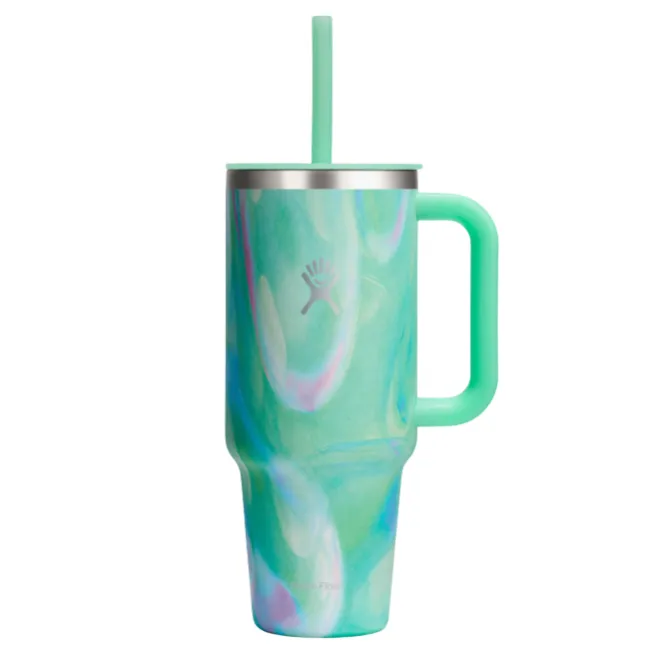 A mint green Hydro Flask tumbler with a swirling pattern, featuring a handle and a straw, designed for keeping drinks insulated.