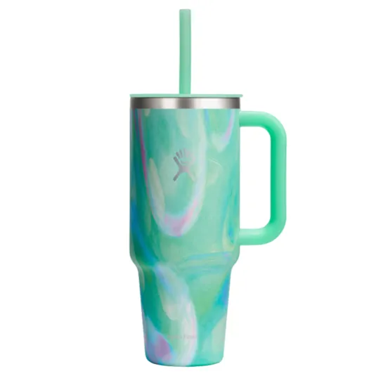 A mint green Hydro Flask tumbler with a swirling pattern, featuring a handle and a straw, designed for keeping drinks insulated.