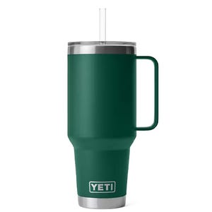 Green YETI Rambler tumbler with a handle, straw lid, and stainless steel accents.
