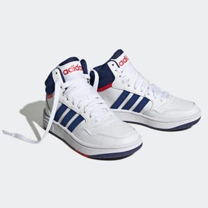 A pair of white Adidas high-top sneakers with blue stripes and red accents.