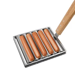 A hot dog grilling tray holds five sausages over a flame, featuring a wooden handle marked with \“North Point.\“
