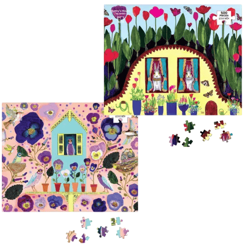 Two colorful jigsaw puzzles with whimsical illustrations of houses surrounded by flowers and nature. One puzzle is 500 pieces, featuring a garden with rabbits; the other shows birds and flowers in vibrant colors.