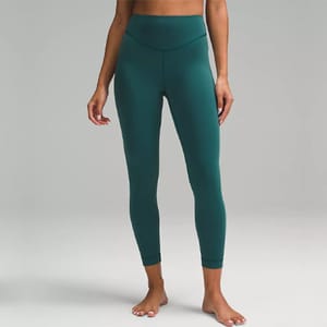 A pair of teal-colored, high-waisted leggings.