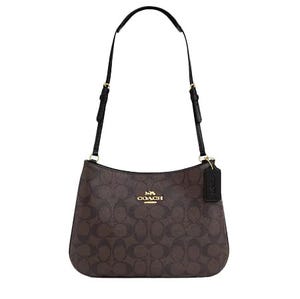 A brown Coach shoulder bag with the brand's signature monogram print and a gold logo on the front.