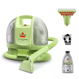 Bissell Little Green Mini portable carpet cleaner with attachments, including a scrubbing tool, a flexible hose, and a bottle of OXY Spot & Stain cleaning solution.