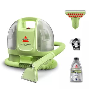 Bissell Little Green Mini portable carpet cleaner with attachments, including a scrubbing tool, a flexible hose, and a bottle of OXY Spot & Stain cleaning solution.