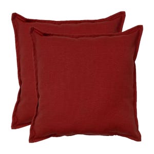 Two deep red square pillows with a simple, solid design and a slightly textured fabric surface.