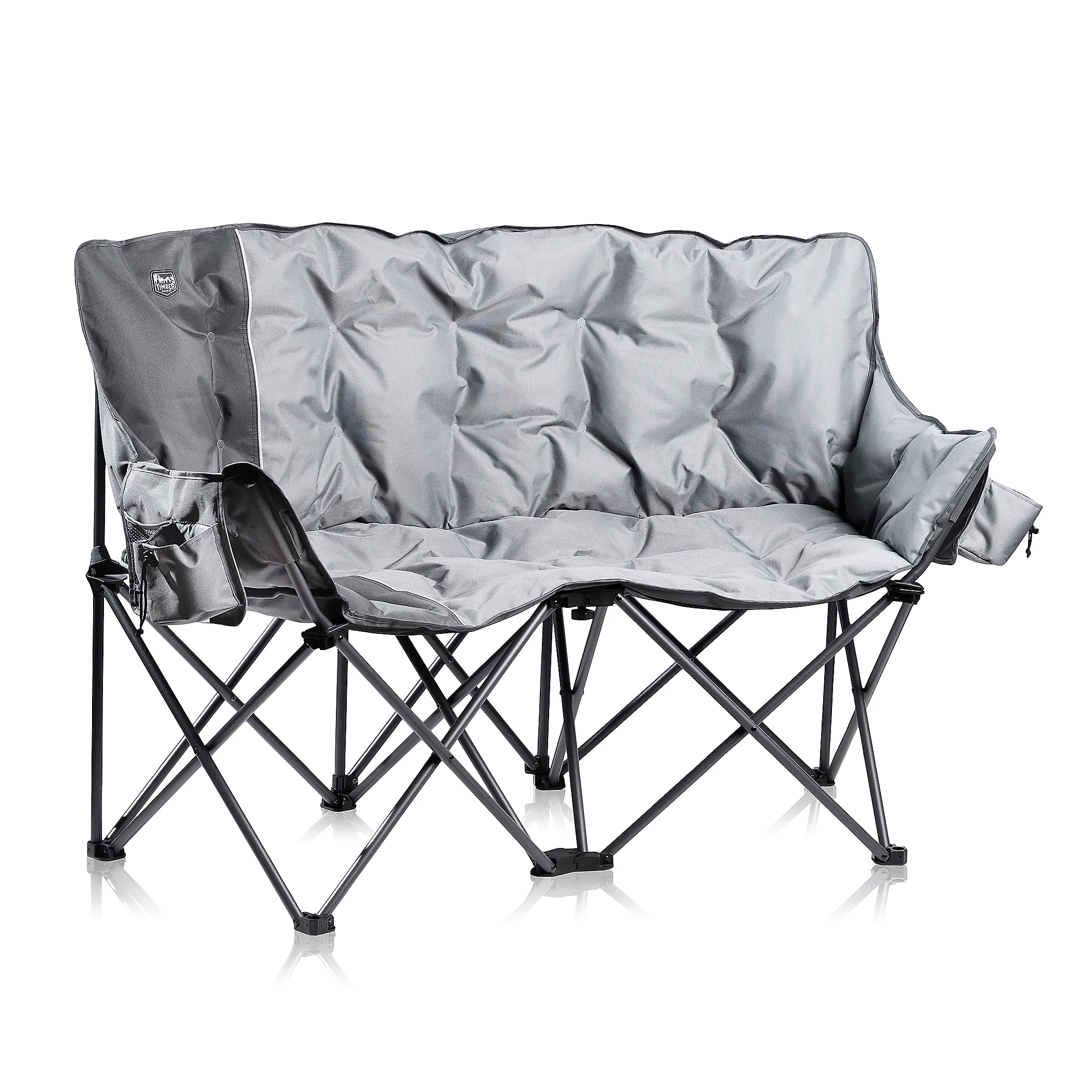 A foldable grey camping loveseat with a sturdy metal frame and cushioned fabric seat, featuring armrest pouches for storage.