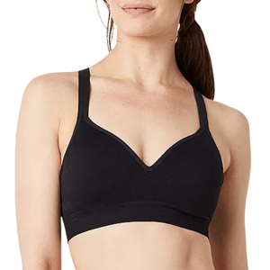 A woman is wearing a black sports bra with a V-neck design and wide straps.
