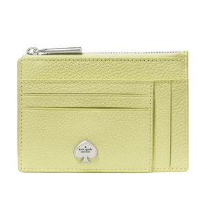 A light green leather cardholder with a zippered compartment, multiple card slots, and a metallic spade logo.