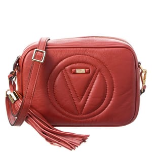 Valentino Mia Crossbody in red leather features a quilted \“V\“ logo design, a detachable shoulder strap, gold-tone hardware, and a tassel accent.