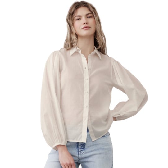 A cream-colored Banana Republic puff sleeve shirt with long sleeves, button-down front, and soft fabric, paired with light blue jeans.