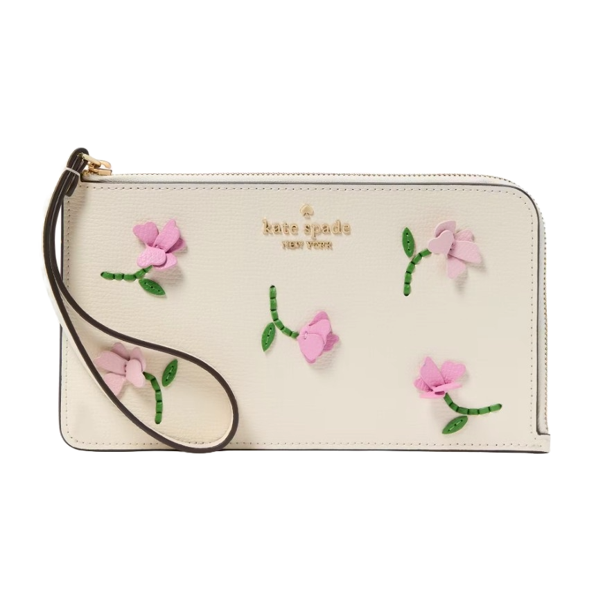 Kate Spade Applique Leather Wristlet features a cream background adorned with pink floral appliques and has a wrist strap. The brand's name is embossed in gold.