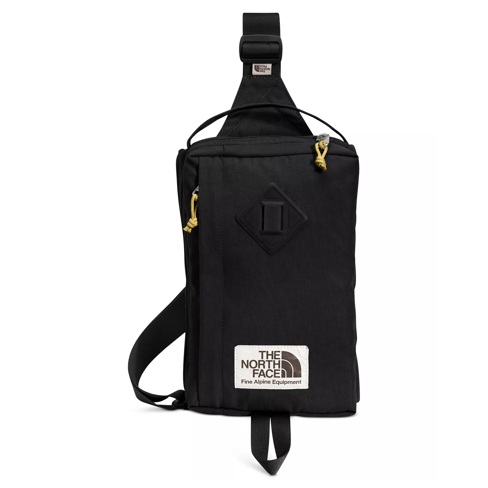 Black sling bag with yellow zipper pull tabs and a \“The North Face Fine Alpine Equipment\“ label.
