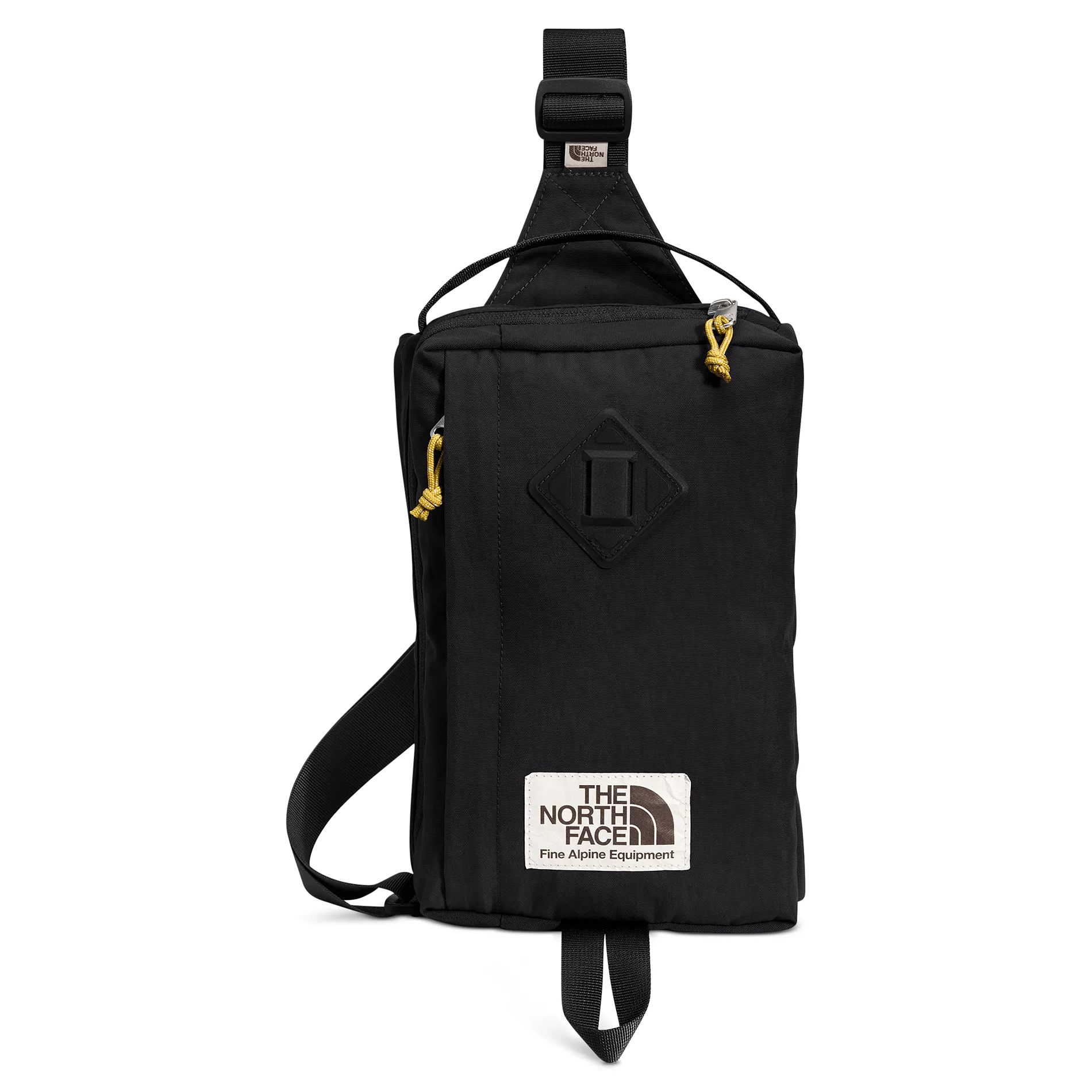 Black sling bag with yellow zipper pull tabs and a \“The North Face Fine Alpine Equipment\“ label.
