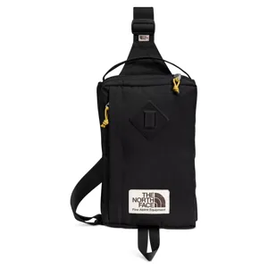 Black sling bag with yellow zipper pull tabs and a \“The North Face Fine Alpine Equipment\“ label.