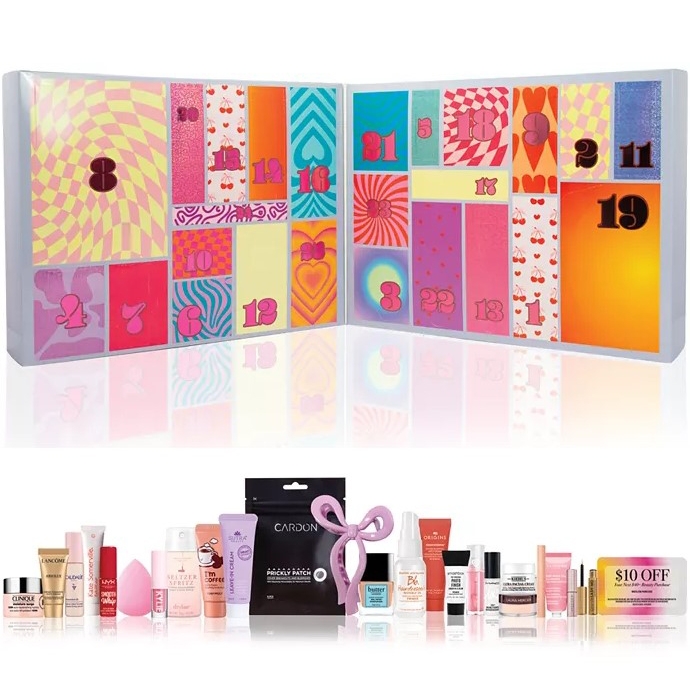 An advent calendar with numbered compartments holds various skincare and beauty products, including creams, masks, and a beauty sponge.