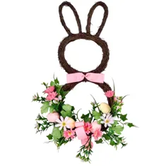 A decorative wreath shaped like a bunny with two pink bows, adorned with pink flowers, greenery, and small eggs.