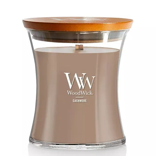 WoodWick Cashmere candle with a wooden lid, featuring a curved glass container and a wooden wick for a crackling fire effect.