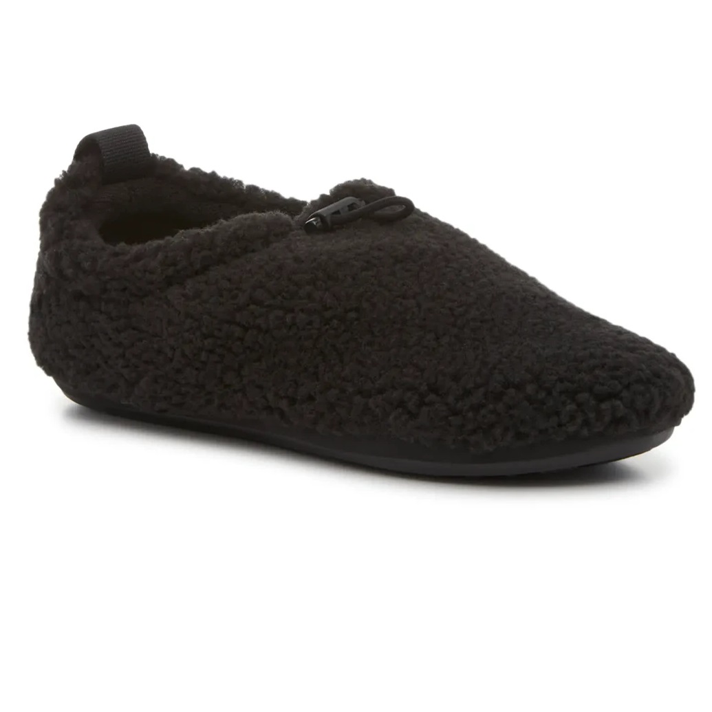 Black UGG Plushy Slippers with a textured, soft exterior resembling fleece or sherpa material, featuring a slip-on design and a small drawstring accent on top for added detail.