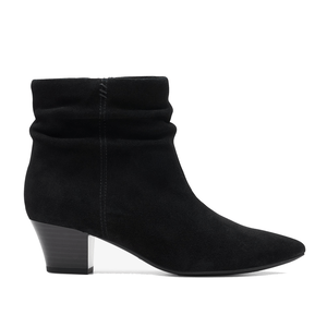 Black suede ankle booties from Clarks featuring a mid-height stacked heel and a slouchy shaft design with subtle stitching detail.