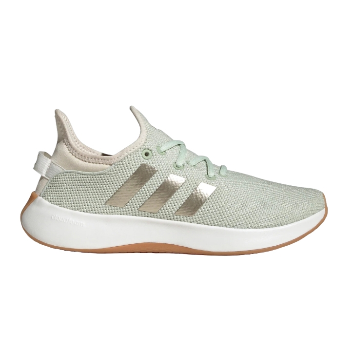 A light green Adidas running shoe with metallic stripes, featuring a white Cloudfoam sole and a light brown outsole, designed for comfort.