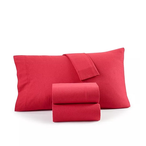 A red sheet set featuring a red pillow.