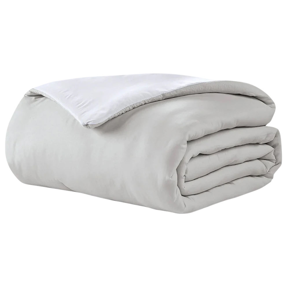 White reversible comforter with a smooth finish, featuring a simple and elegant design suitable for minimalist or modern bedrooms.