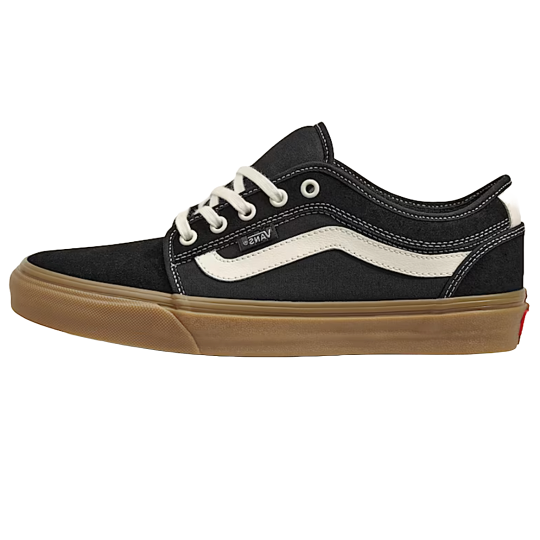 A black low-top skate shoe with a white stripe and gum-colored sole, featuring white laces and visible branding.