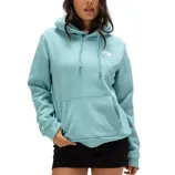 A woman is wearing a light blue North Face hoodie with a kangaroo pocket and drawstring hood, paired with a black skirt.