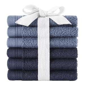 A stack of six blue towels tied with a white ribbon, featuring different shades ranging from light to dark.