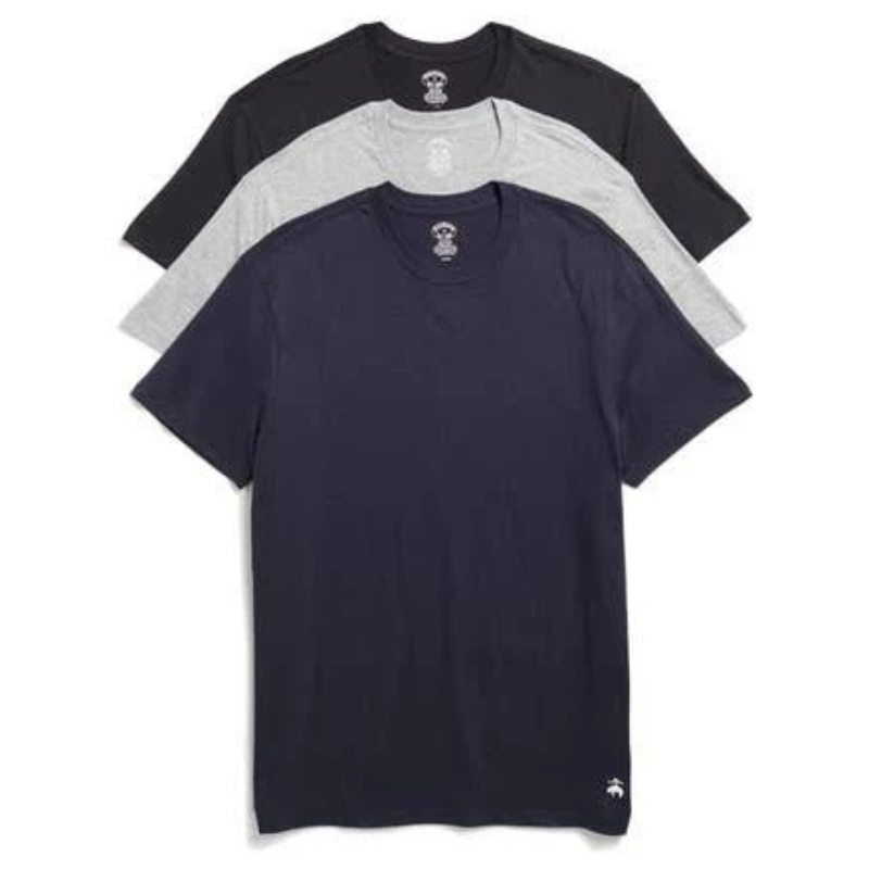 Three crew neck t-shirts in navy, gray, and black are stacked, displaying their short sleeves and simple design. A small logo is visible on the bottom corner of the top shirt.