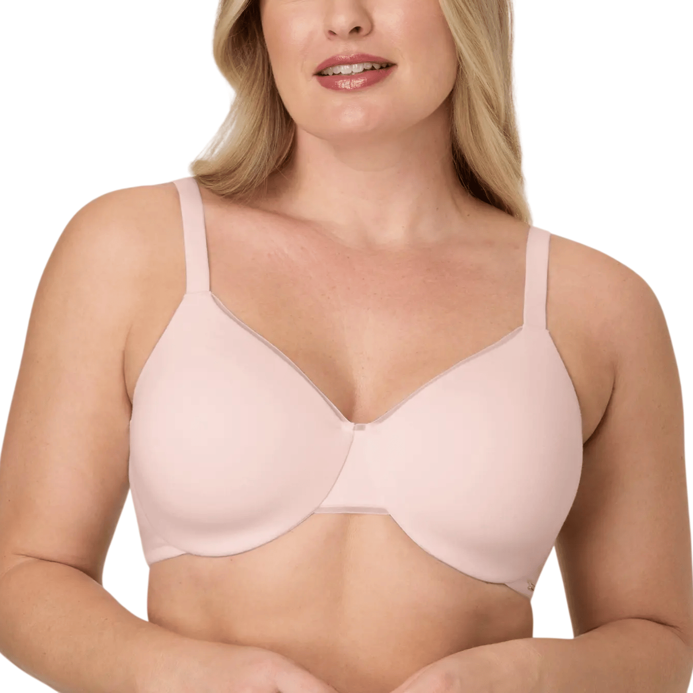 A woman wears a light pink, seamless underwire bra with adjustable straps designed for comfort.