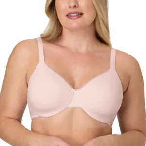 A woman wears a light pink, seamless underwire bra with adjustable straps designed for comfort.