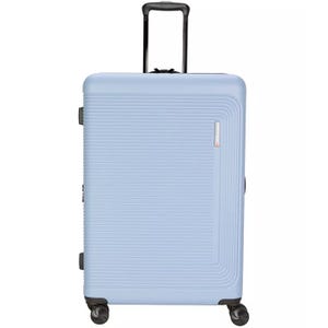 Light blue hard-shell suitcase with textured surface, retractable handle, and four spinner wheels.