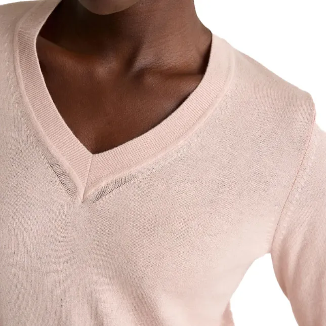 A close-up of a light pink V-neck sweater featuring ribbed detailing at the neckline and stitching accents on the shoulders and sides.