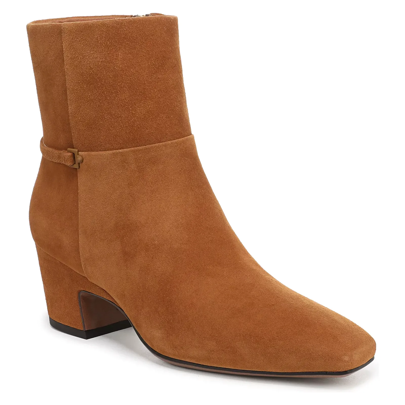 A tan suede ankle boot with a mid-sized block heel and a minimalist design, featuring a subtle strap detail around the ankle.