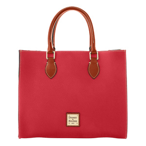 A red Dooney & Bourke tote bag with brown leather handles and white stitching, featuring the brand's logo on the front.
