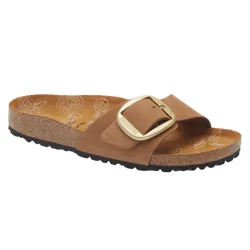 A brown Birkenstock sandal with a large gold buckle and a cork sole. The footbed features a floral pattern.