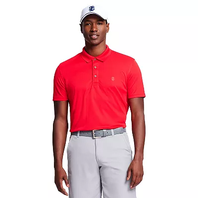 A red IZOD golf polo shirt featuring a ribbed collar, three-button placket, and an embroidered logo on the chest, paired with light grey pants.