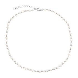 A delicate necklace featuring alternating small white pearls and sparkling crystals, complete with a silver lobster clasp and an adjustable chain.