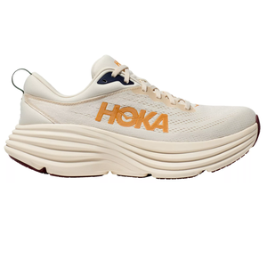 Hoka running shoe in a cream color with orange logo, featuring a thick, cushioned sole for support.