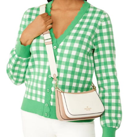 A green and white gingham cardigan paired with a white crossbody bag with a gold-tone logo.