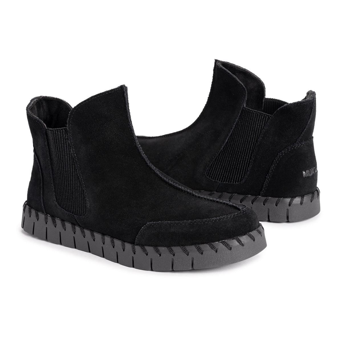 Black suede Chelsea booties with elastic side panels and a chunky, ridged rubber sole.
