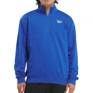 Blue Reebok quarter-zip pullover with a high collar, featuring the brand logo on the left chest. The pullover has long sleeves and ribbed cuffs for a comfortable fit.