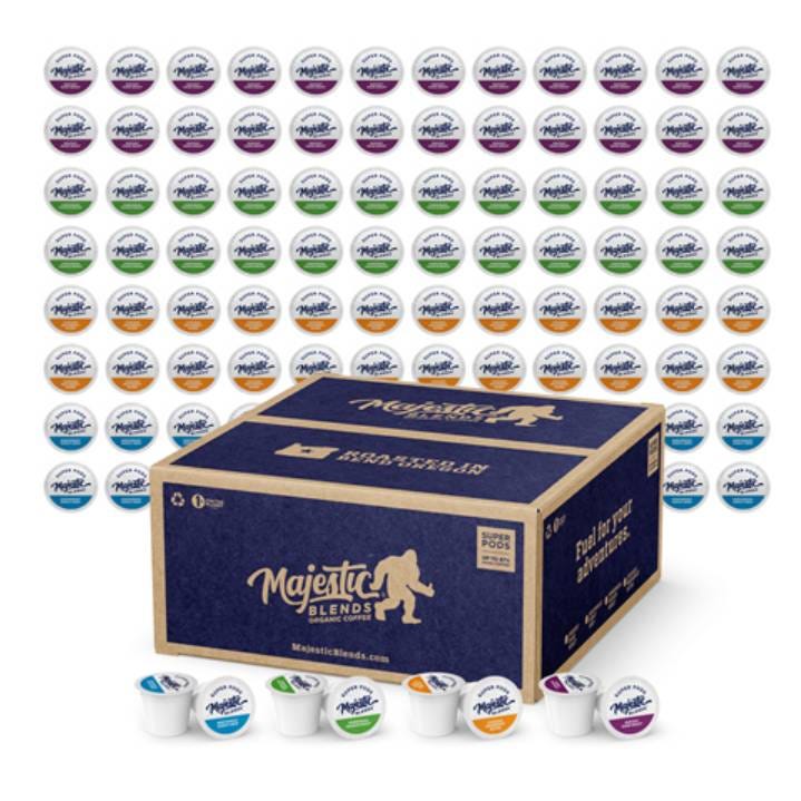 A variety of coffee pods next to a cardboard box labeled \“Majestic Blends.\“